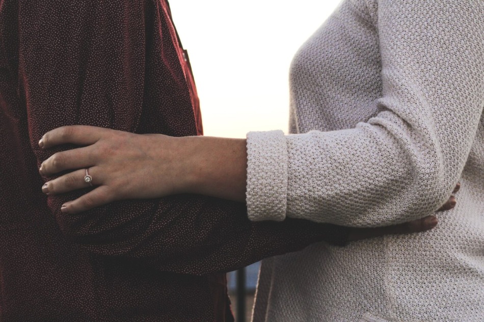 Couple hugging sunset
